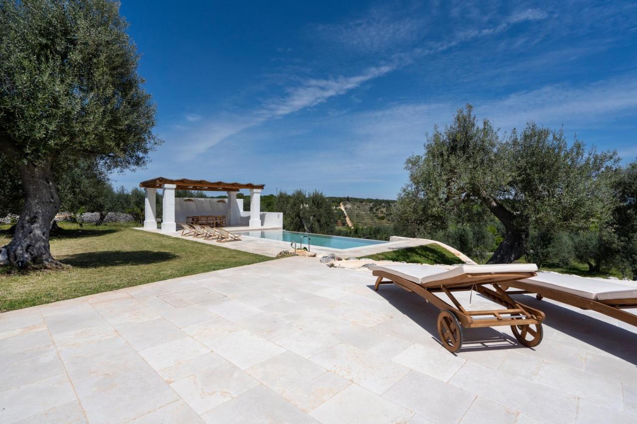 オストゥーニ Trulli Cicerali , Trulli Design Con Piscina Panoramicaヴィラ エクステリア 写真